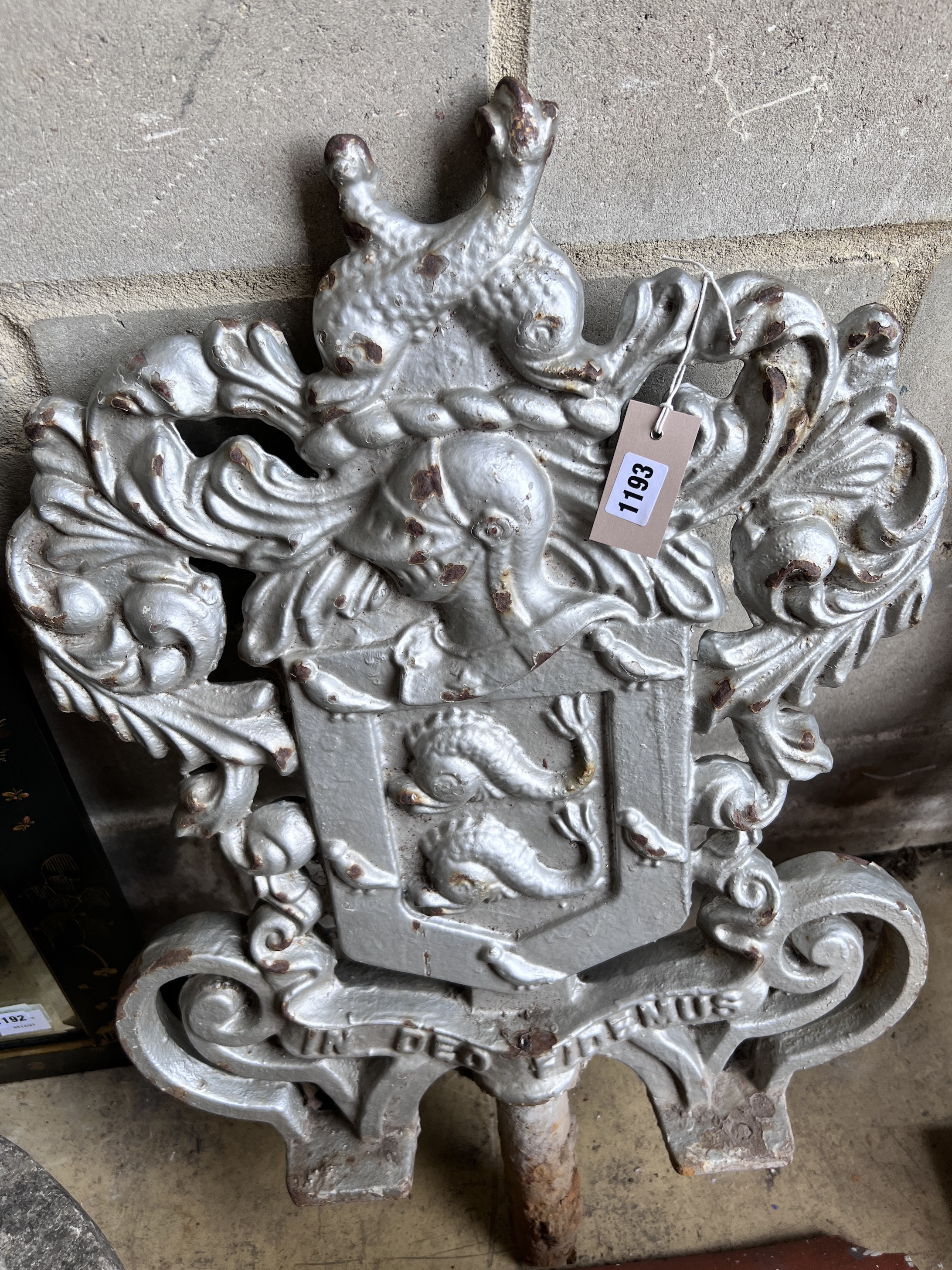 A pair of cast iron armorial capitals with motto 'In Deo Fidemus', height 82cm